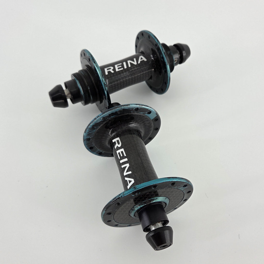 Reina High-Flange Carbon Track Hubs - Turquoise Anodized