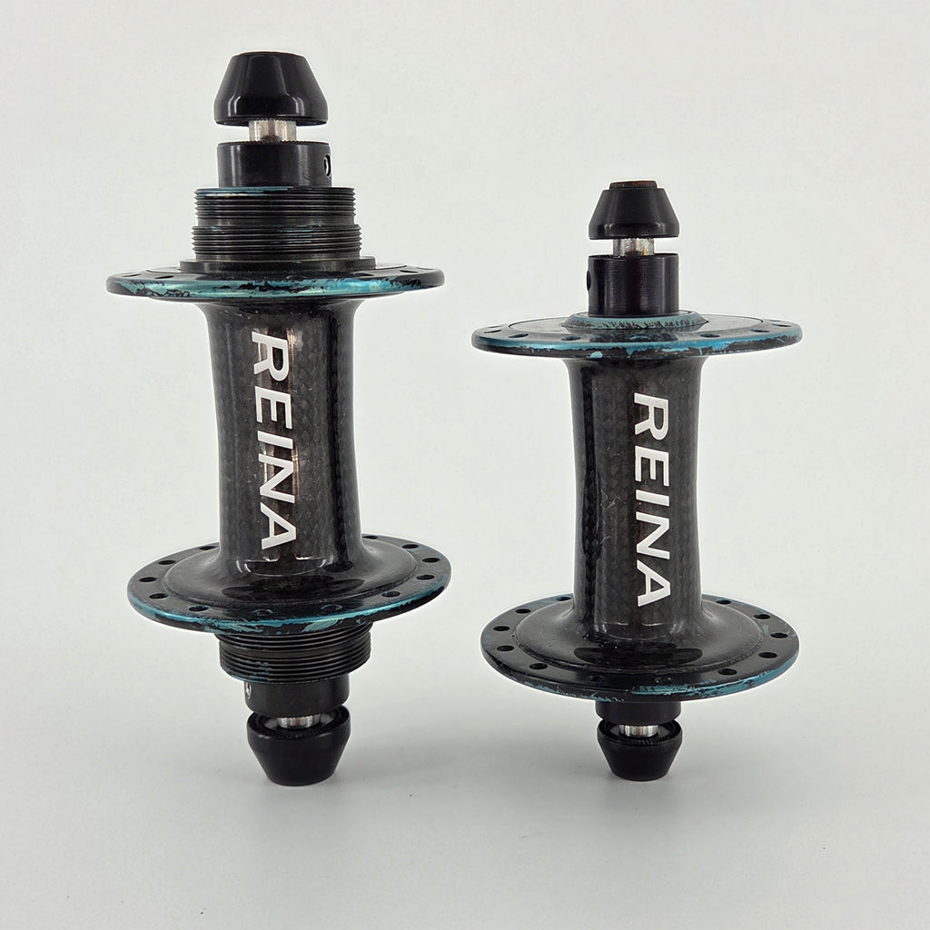 Reina High-Flange Carbon Track Hubs - Turquoise Anodized