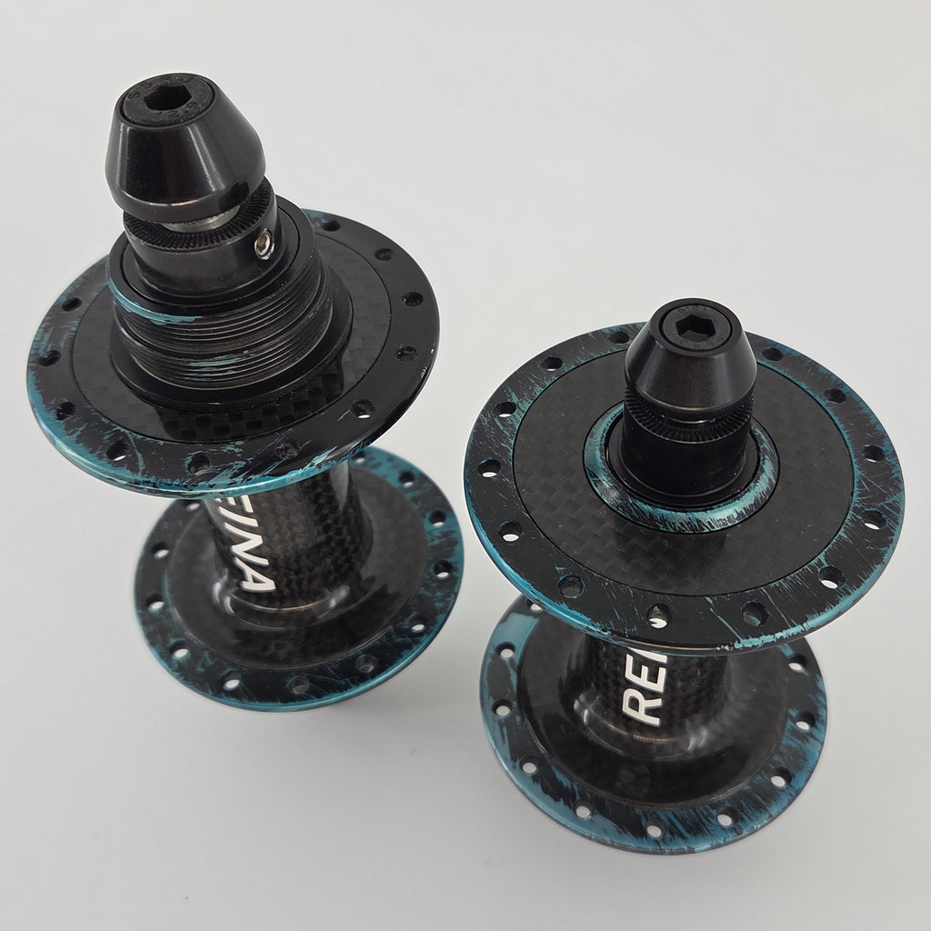 Reina High-Flange Carbon Track Hubs - Turquoise Anodized