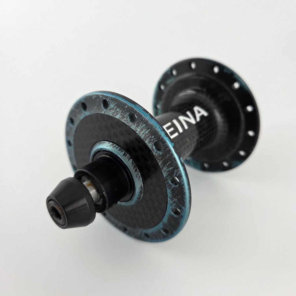 Reina High-Flange Carbon Track Hubs - Turquoise Anodized
